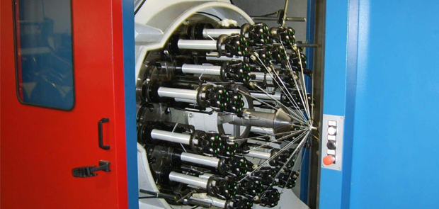 Taping and braiding machine